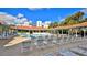 Expansive pool and deck area with plenty of seating and shade, set against a backdrop of the building's architecture at 5300 S Atlantic Ave # 5-502, New Smyrna Beach, FL 32169