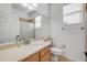 Bathroom featuring single vanity, mirror, toilet, and shower with curtain at 5849 Ansley Way, Mount Dora, FL 32757