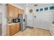Bright kitchen featuring stainless steel appliances and tile flooring at 5849 Ansley Way, Mount Dora, FL 32757