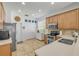 Bright kitchen featuring stainless steel appliances, ample counter space, and tile flooring at 5849 Ansley Way, Mount Dora, FL 32757