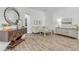 Cozy living room with hardwood floors, stylish furnishings, and plenty of natural light at 5849 Ansley Way, Mount Dora, FL 32757