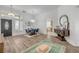 Spacious living room featuring hardwood floors, high ceilings, and an open floor plan at 5849 Ansley Way, Mount Dora, FL 32757
