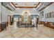 The grand lobby has beautiful tile floors, wooden accents, and decorative lighting, creating a welcoming community space at 5849 Ansley Way, Mount Dora, FL 32757
