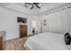 Spacious bedroom boasts a tray ceiling, ceiling fan, and modern furnishings at 5849 Ansley Way, Mount Dora, FL 32757