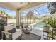 Screened-in porch featuring comfortable outdoor seating and views of the pool area at 5849 Ansley Way, Mount Dora, FL 32757