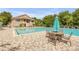 Resort-style swimming pool with a spacious deck, ample seating, and lush landscaping for the ultimate relaxation at 5849 Ansley Way, Mount Dora, FL 32757