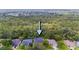 Aerial view of the home highlighting its location surrounded by lush trees at 6065 Spruce Point Cir, Port Orange, FL 32128