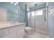 This bathroom includes a walk-in shower, a sink with vanity, and modern fixtures at 6065 Spruce Point Cir, Port Orange, FL 32128