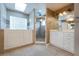Bright primary bathroom with a shower, a walk-in tub, double sinks, and tile flooring at 6065 Spruce Point Cir, Port Orange, FL 32128