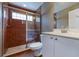 Bathroom featuring glass enclosed shower, white vanity, toilet, and updated fixtures at 6065 Spruce Point Cir, Port Orange, FL 32128