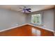 Bright empty bedroom with hardwood floors, a ceiling fan, and a window with natural light at 6065 Spruce Point Cir, Port Orange, FL 32128