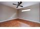 Bedroom features neutral walls, stylish tile flooring, and a window for natural light at 6065 Spruce Point Cir, Port Orange, FL 32128