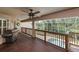 This covered deck has an outdoor grill, and provides access to the screened in pool area at 6065 Spruce Point Cir, Port Orange, FL 32128