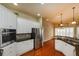 Well-lit kitchen with granite counters, stainless appliances, and breakfast nook at 6065 Spruce Point Cir, Port Orange, FL 32128