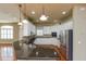 Spacious kitchen with white cabinetry, stainless steel appliances, and a granite island countertop at 6065 Spruce Point Cir, Port Orange, FL 32128