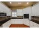 Bright kitchen with white cabinets, stainless appliances, and tile backsplash at 6065 Spruce Point Cir, Port Orange, FL 32128