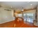 Open-concept living room with fireplace and views of the lanai at 6065 Spruce Point Cir, Port Orange, FL 32128