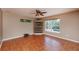 Living room with beautiful tile flooring, lots of natural light, and a built-in shelving unit at 6065 Spruce Point Cir, Port Orange, FL 32128