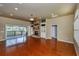Spacious living room with fireplace, hardwood floors, and deck access at 6065 Spruce Point Cir, Port Orange, FL 32128
