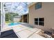 The outdoor space features a screened-in pool, deck, and mature landscaping, creating a serene backyard retreat at 6065 Spruce Point Cir, Port Orange, FL 32128