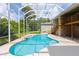 This home boasts a screened-in pool, deck, and private backyard oasis, perfect for entertaining and relaxation at 6065 Spruce Point Cir, Port Orange, FL 32128