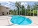 The screened-in pool offers a relaxing atmosphere, complemented by the well-maintained backyard and landscaping at 6065 Spruce Point Cir, Port Orange, FL 32128
