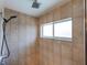 Modern shower features beige tile, rainfall shower head, handheld sprayer, and a window for natural light at 6065 Spruce Point Cir, Port Orange, FL 32128