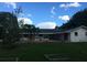 Back exterior view of home with patio and garden at 4500 S Hiawassee Rd, Orlando, FL 32835
