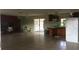 Spacious kitchen with tiled floor and brick fireplace at 4500 S Hiawassee Rd, Orlando, FL 32835
