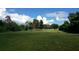 Large grassy lot with mature trees at 4500 S Hiawassee Rd, Orlando, FL 32835