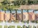 Aerial view of houses with private pools and solar panels at 5244 Oakbourne Ave, Davenport, FL 33837