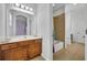 Well-lit bathroom with a shower/tub combo and vanity at 5244 Oakbourne Ave, Davenport, FL 33837