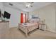 Comfortable bedroom with a queen-size bed and stylish decor at 5244 Oakbourne Ave, Davenport, FL 33837