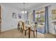 Bright dining room with table for six and view of backyard at 5244 Oakbourne Ave, Davenport, FL 33837