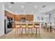 Modern kitchen with breakfast bar and granite countertops at 5244 Oakbourne Ave, Davenport, FL 33837