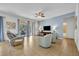 Living room with light walls, light gray furniture, and access to a patio at 5244 Oakbourne Ave, Davenport, FL 33837