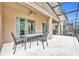 Patio with table and chairs near pool at 5244 Oakbourne Ave, Davenport, FL 33837