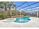 Inviting pool with spa and screened enclosure at 5244 Oakbourne Ave, Davenport, FL 33837