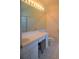 Bathroom with a large mirror, single sink vanity, and a toilet with white tiling at 3918 Doune Way, Clermont, FL 34711