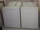 Bright laundry area with a white dryer and washing machine, offering convenience and functionality at 3918 Doune Way, Clermont, FL 34711