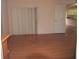 Spacious living room with hardwood floors and a sliding glass door to a patio at 3918 Doune Way, Clermont, FL 34711
