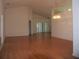 Bright living room with gleaming hardwood floors, vaulted ceiling, and lots of natural light at 3918 Doune Way, Clermont, FL 34711