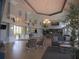 Spacious lobby area with tile floors, comfortable seating, and elegant lighting fixtures at 3918 Doune Way, Clermont, FL 34711