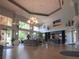 Open lobby area featuring high ceilings, natural light, and stylish decor at 3918 Doune Way, Clermont, FL 34711