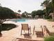 Outdoor pool area with comfortable lounge chairs, mature palm trees and a brick-paved deck at 3918 Doune Way, Clermont, FL 34711