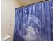 Bathroom featuring a toilet and a shower with a blue moon and star themed shower curtain at 10290 Buck Rd, Orlando, FL 32817