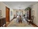 Formal dining room with hardwood floors, chandelier lighting, and a large china cabinet at 10290 Buck Rd, Orlando, FL 32817