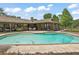 Exterior of home featuring large pool, partially covered patio, and well-maintained landscaping at 10290 Buck Rd, Orlando, FL 32817