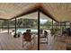 Covered patio area with a swimming pool, outdoor furniture, and tile flooring at 10290 Buck Rd, Orlando, FL 32817