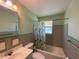 Clean bathroom with a shower/tub combo and updated vanity at 910 Lake Ave, Edgewater, FL 32132